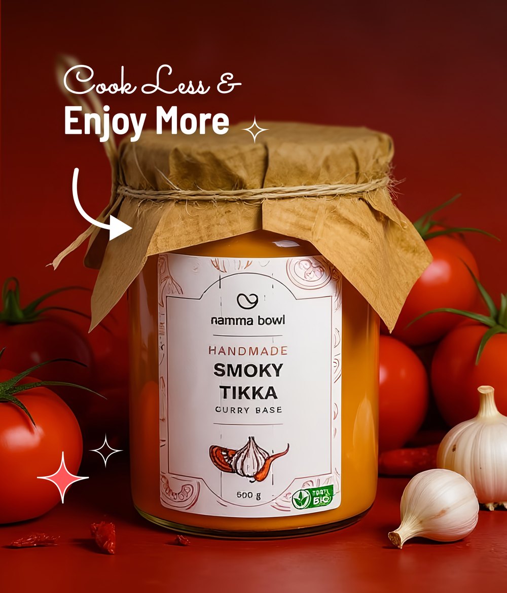 Smoky Tikka jar styled with fresh tomatoes and garlic